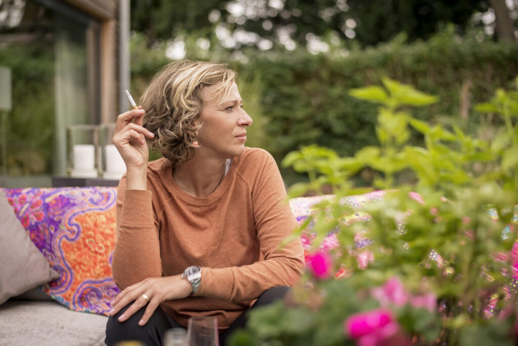 woman holding cigarette