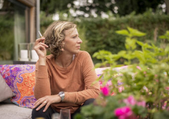 woman holding cigarette